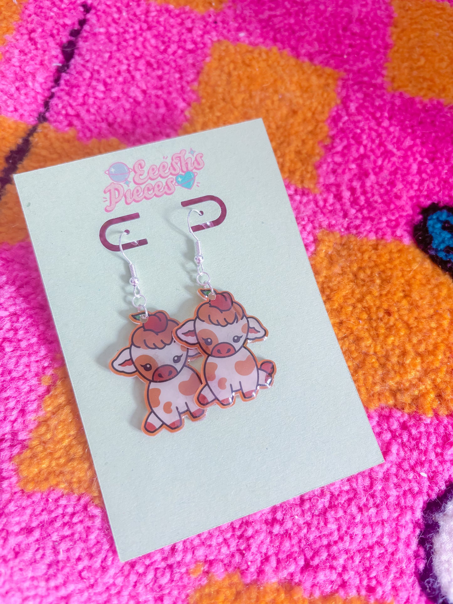 Peach cow earrings