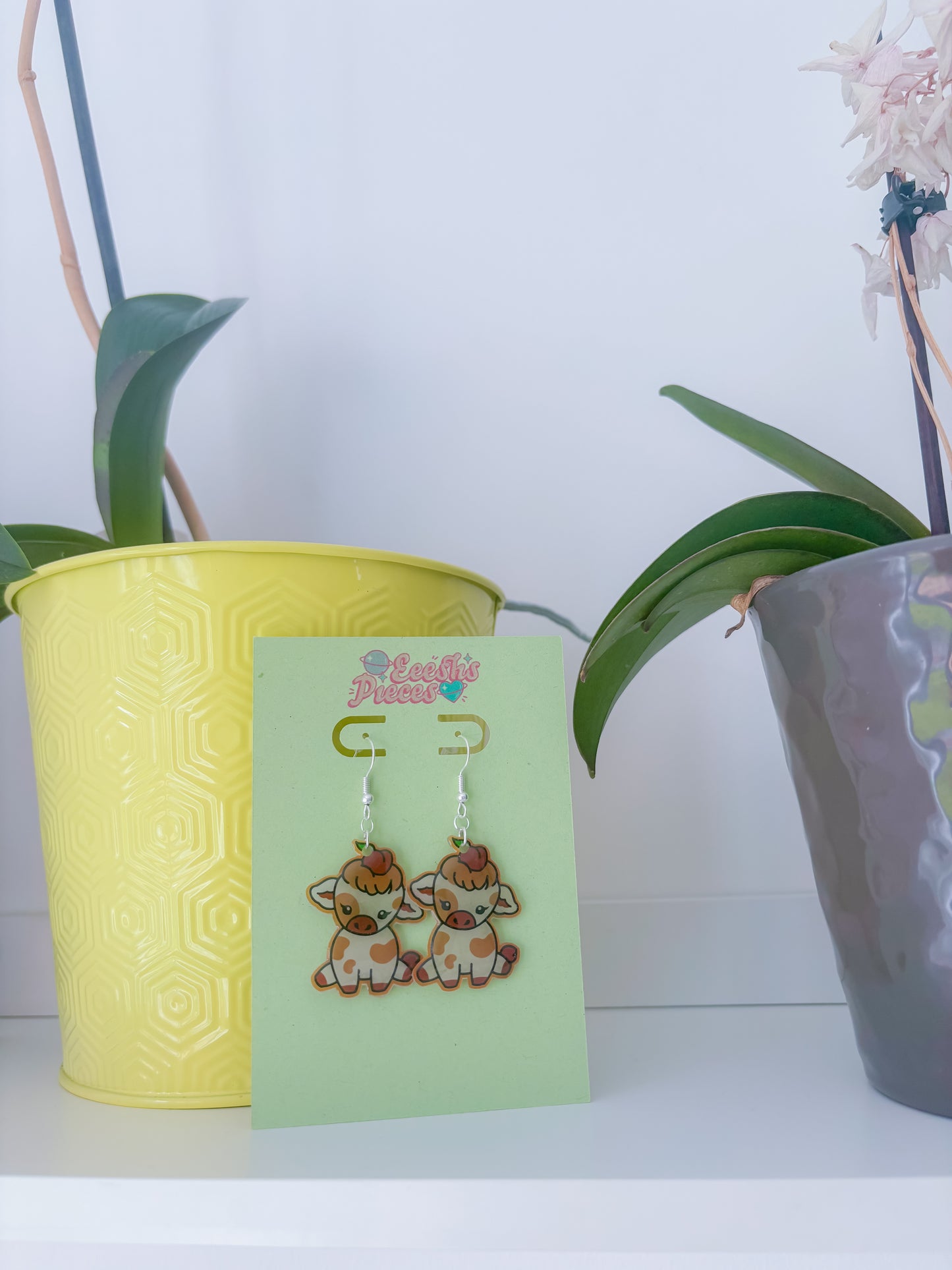 Peach cow earrings