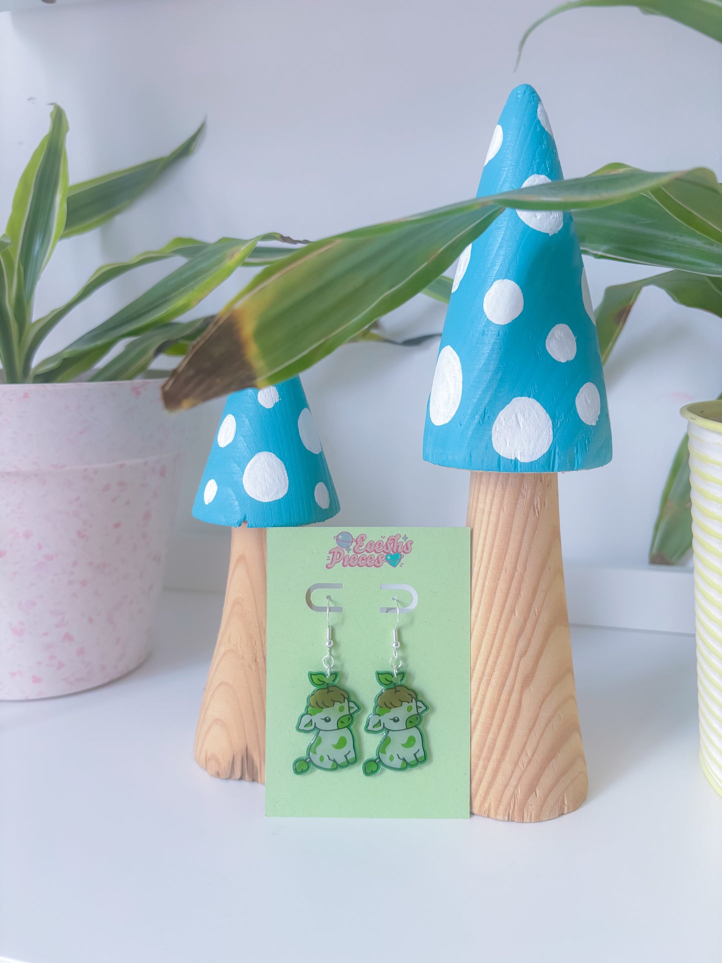 Plant cow earrings