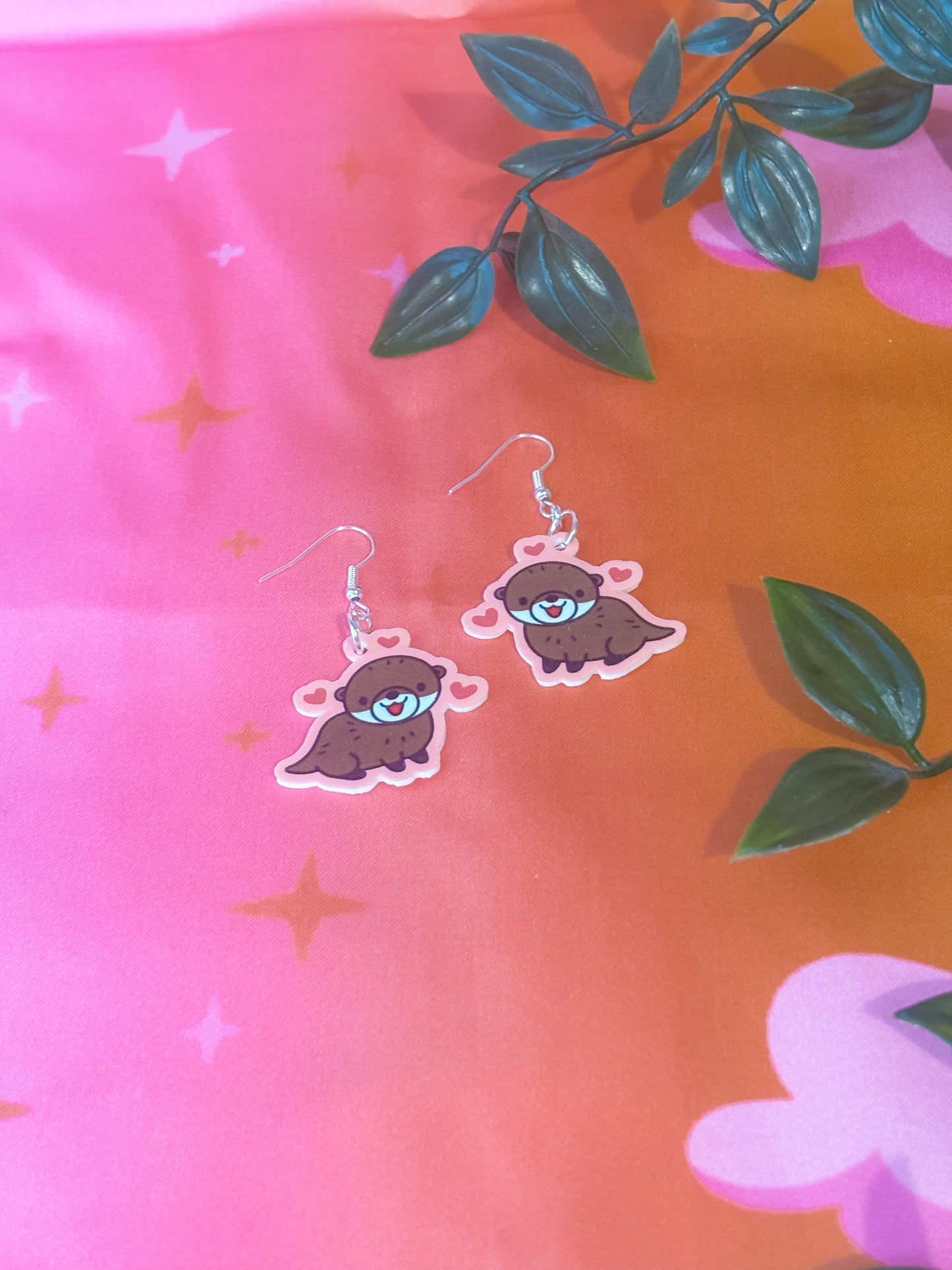 Heart otter earrings